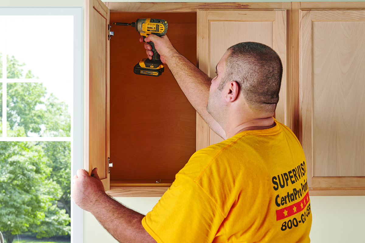 kitchen cabinet hardware being removed