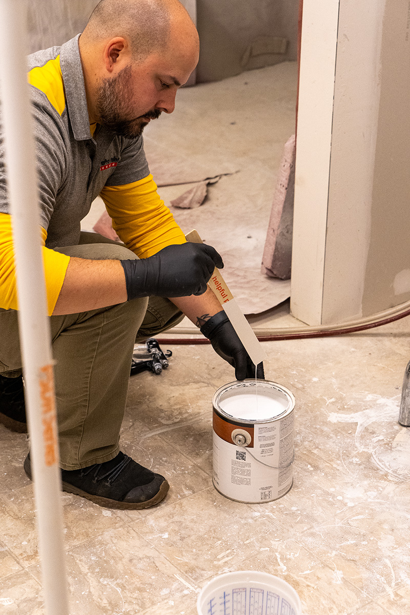 paint can of oil paint and latex paint to paint kitchen cabinets