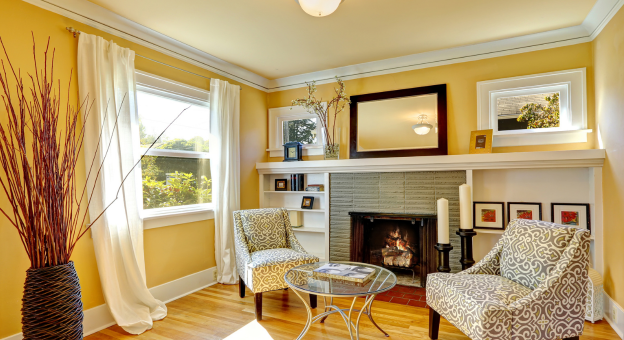 room with yellow walls and white crown molding
