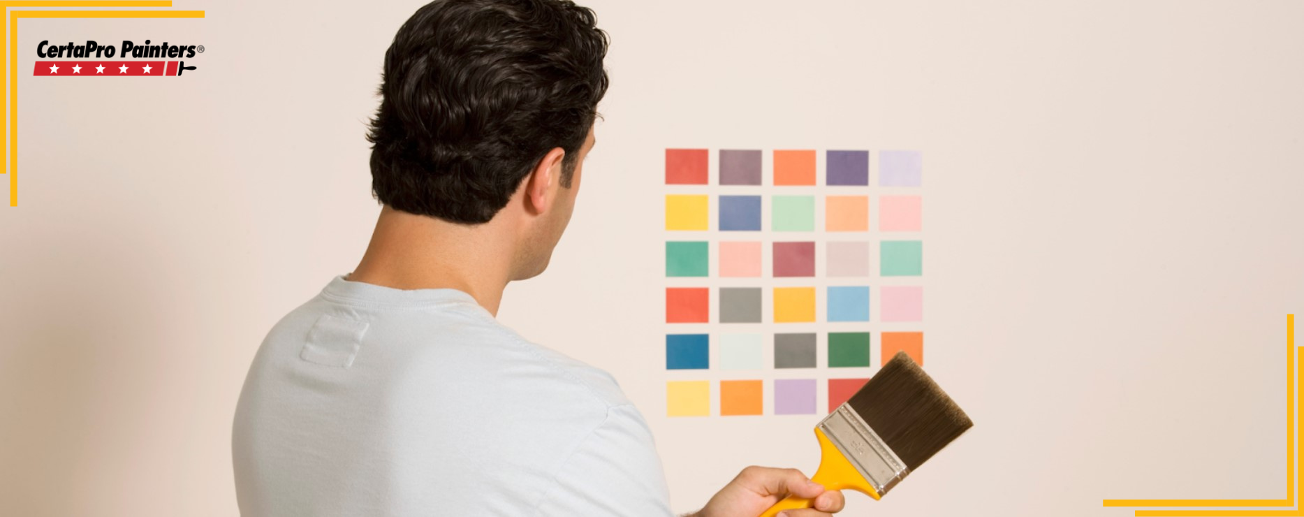 man looking at paint swatches