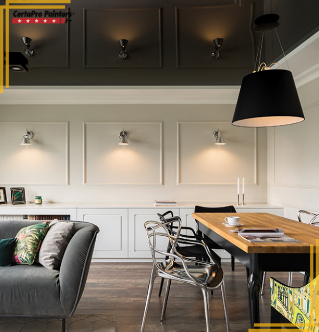 home interior wall with wall sconces and dark upper walls