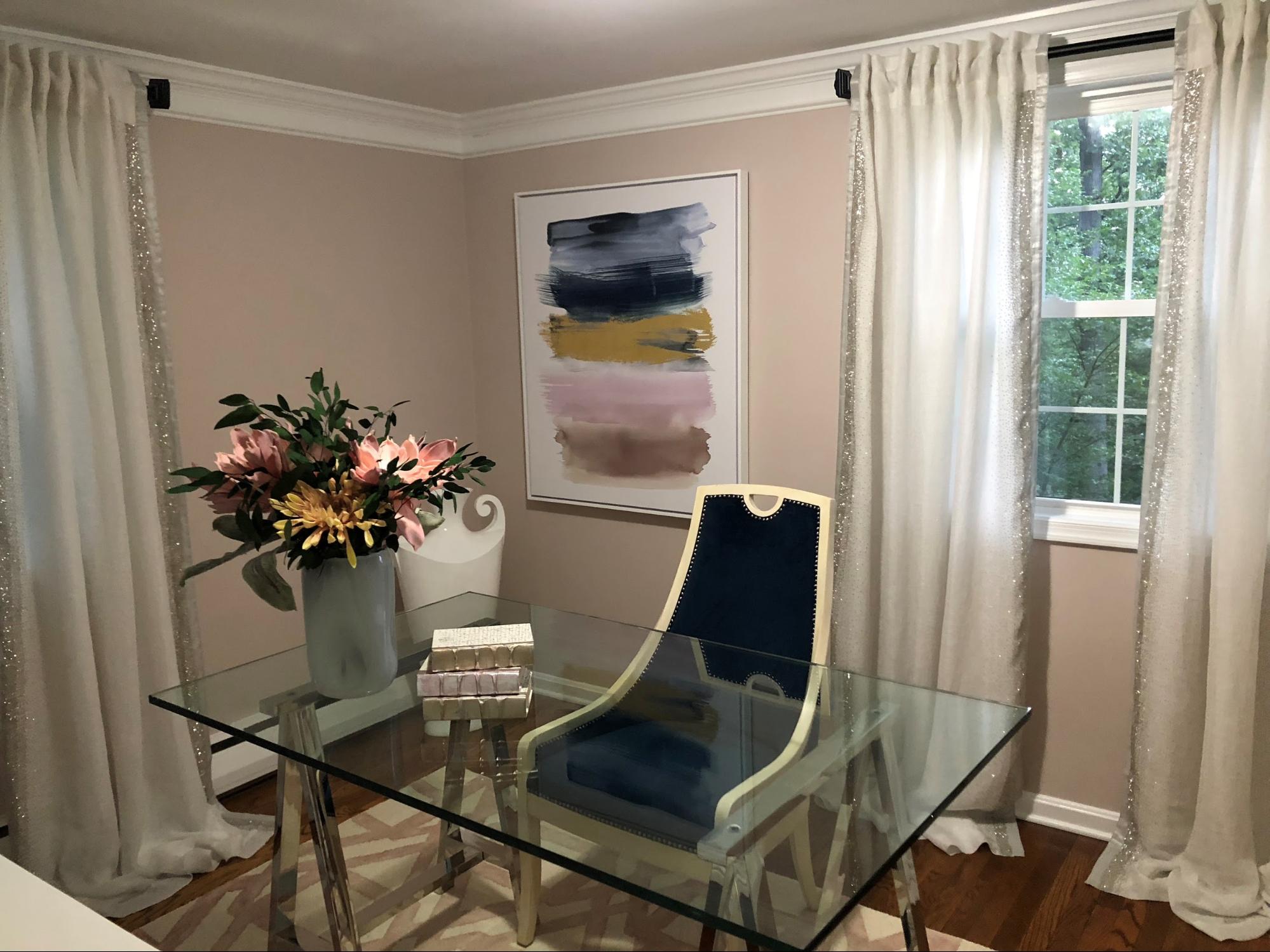 Small and Stylish Mid Century Modern Spare Office Space - Decorated With Slipper Chair and Glass Table Painted Unfussy Beige