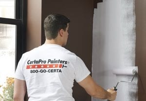 Painter completing work inside a commercial healthcare facility