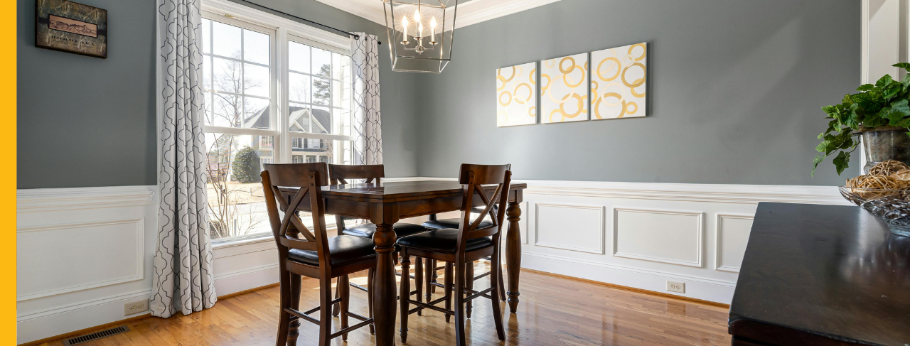 Dining room with white and grey two-toned walls