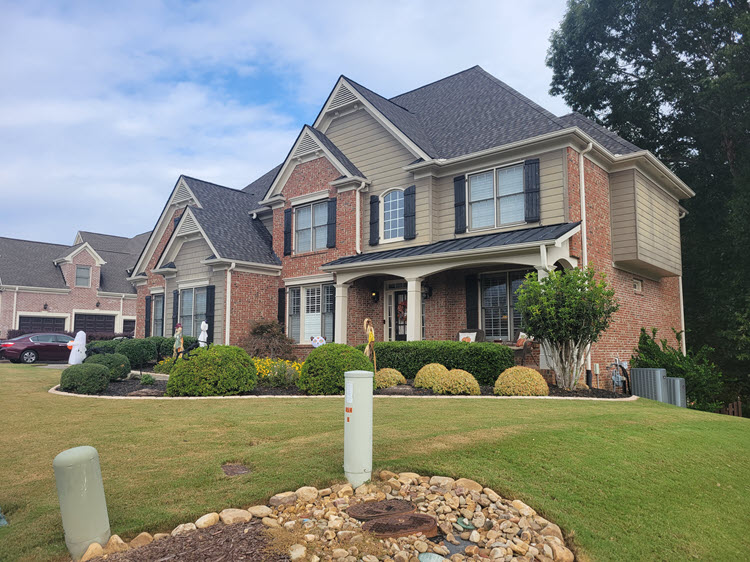 photo of brick home in canton ga before painting