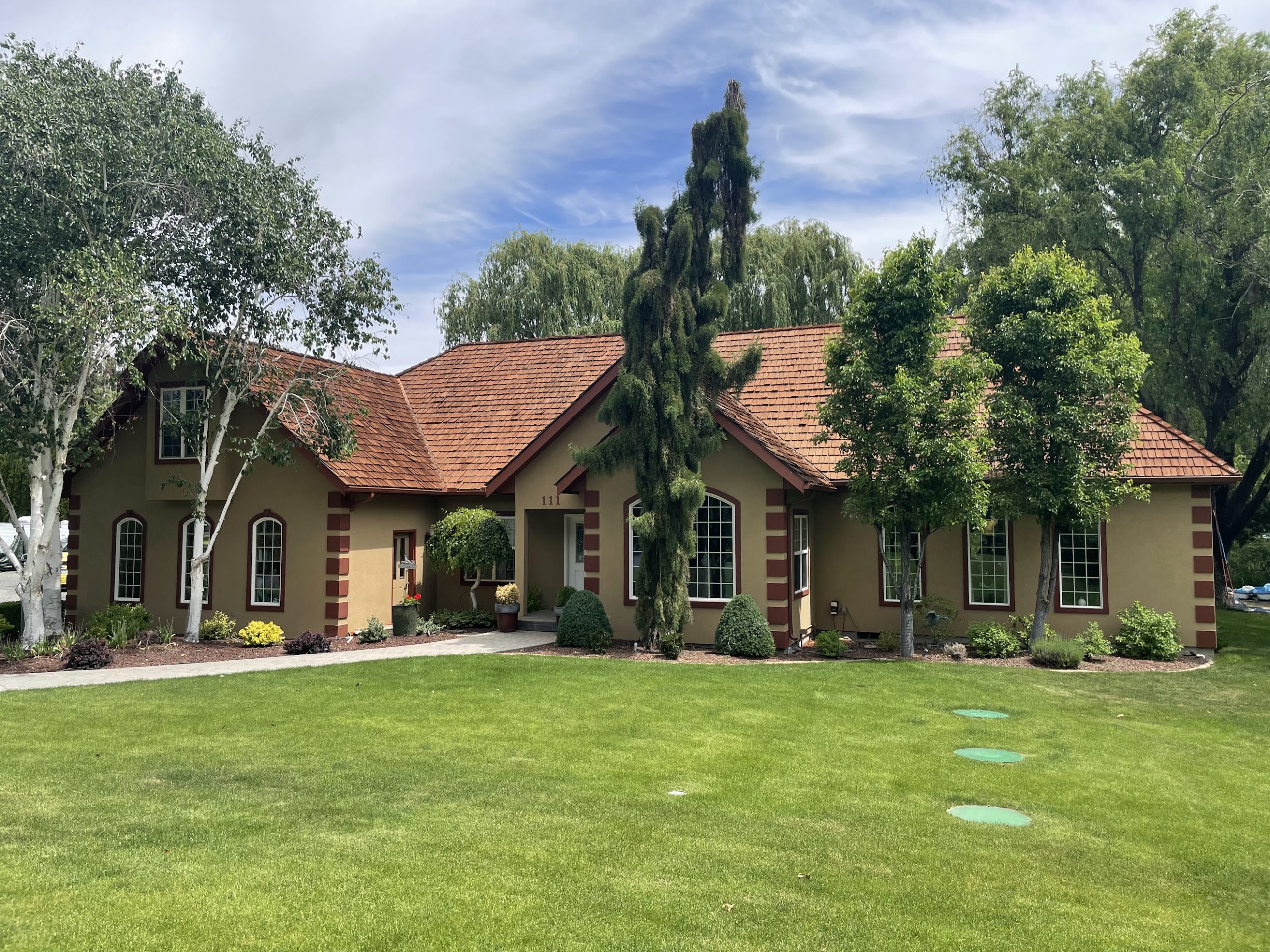 White w/ Black Trim Painted Stucco House Before