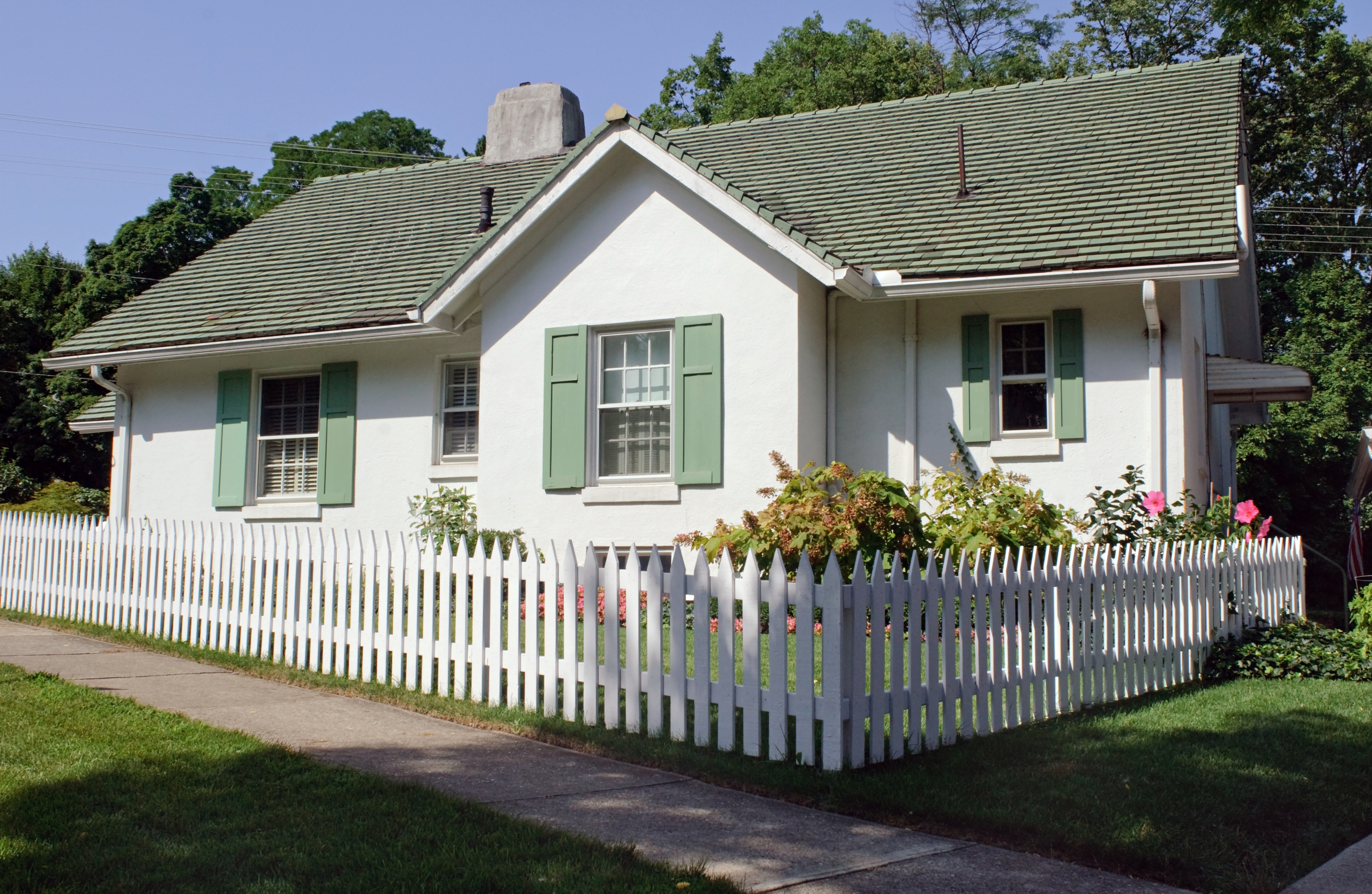 home with white picket fence