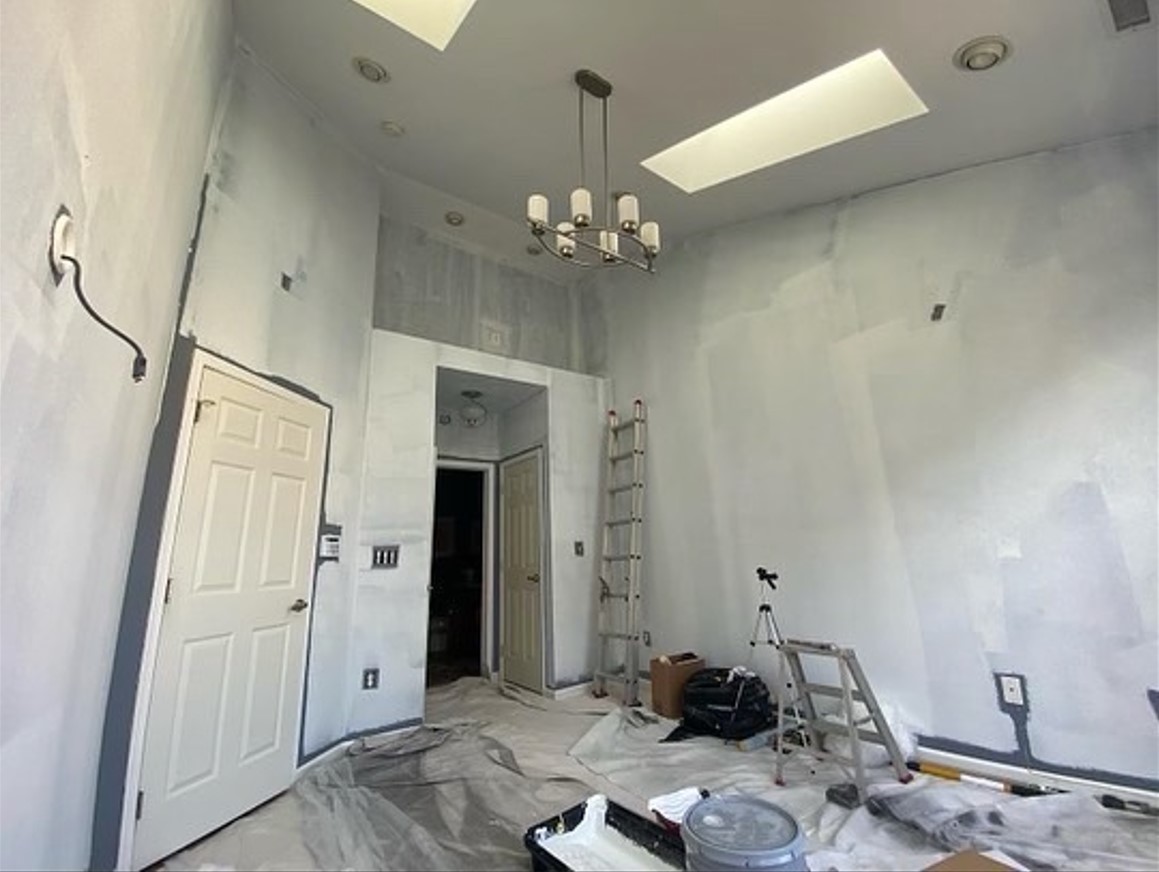 interior room with skylight before painting