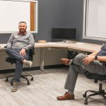 crew sitting in new office