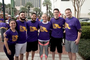 team wearing purple shirts for conference