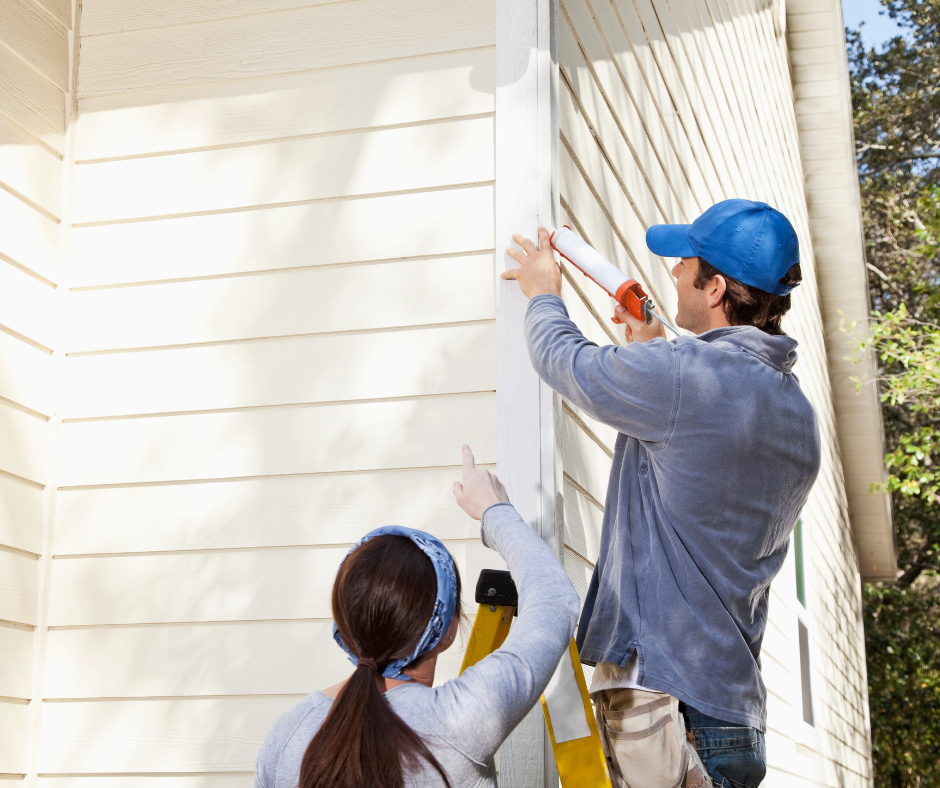couple repairing home exterior in castle rock