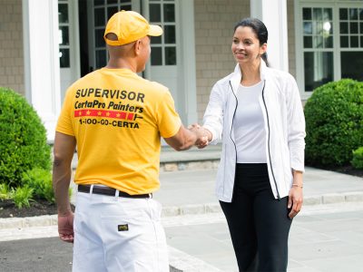 painter shaking hands with customer