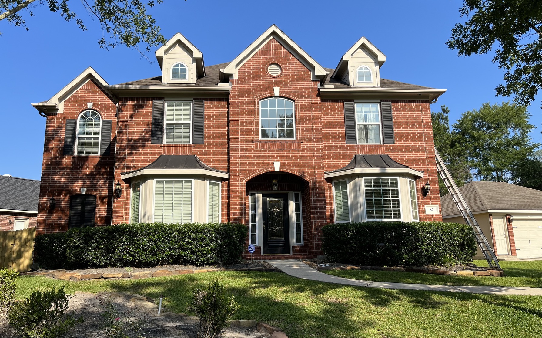 Painting Red Brick and Siding in Pure White Before