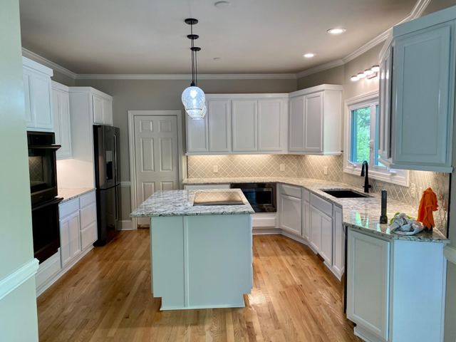 photo of repainted kitchen cabinets and island in sandy springs