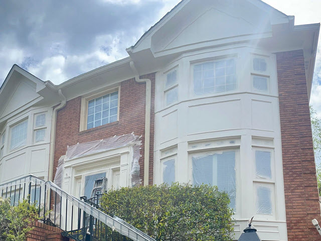 painting in progress photo of brick home in dunwoody