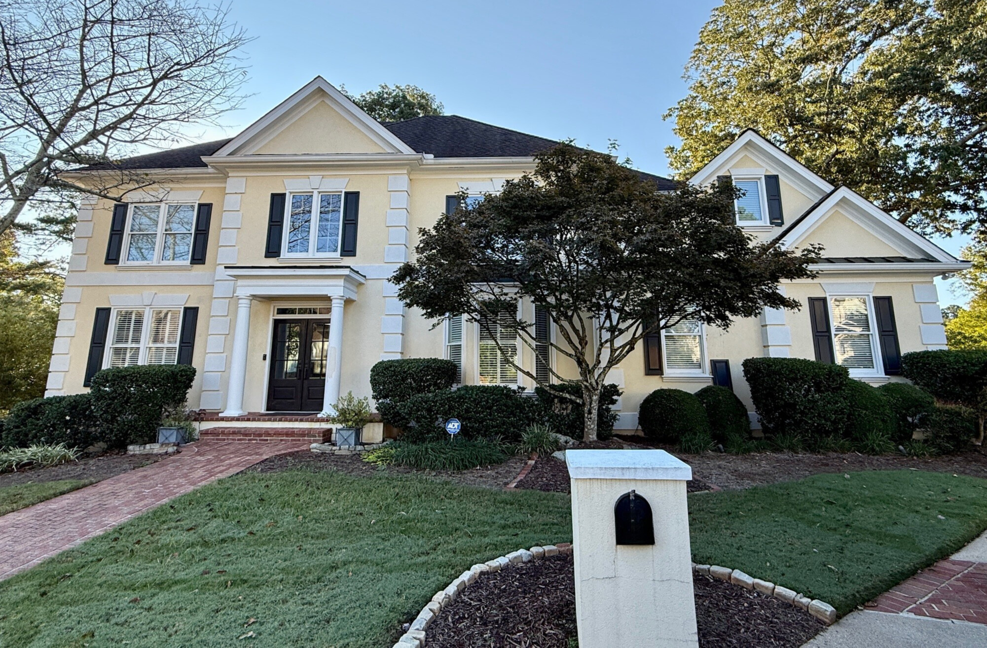 yellow home in dunwoody before being painted