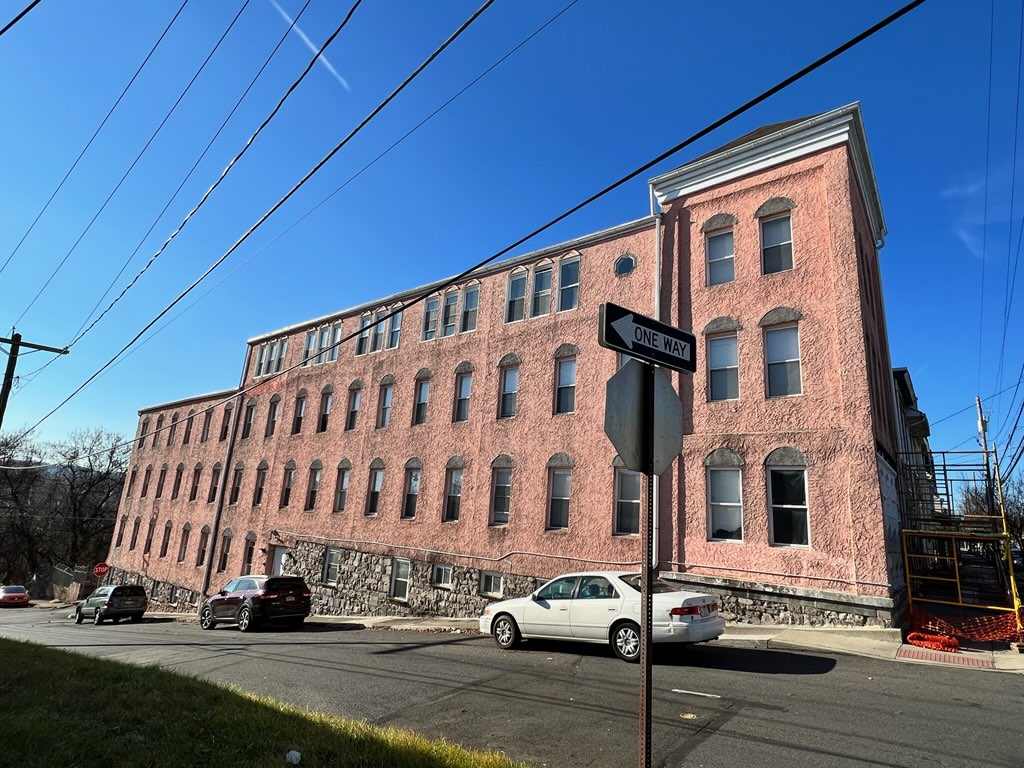 Front of River Rock Management during commercial exterior painting project by CertaPro Painters of the Greater Lehigh Valley - Angle 2