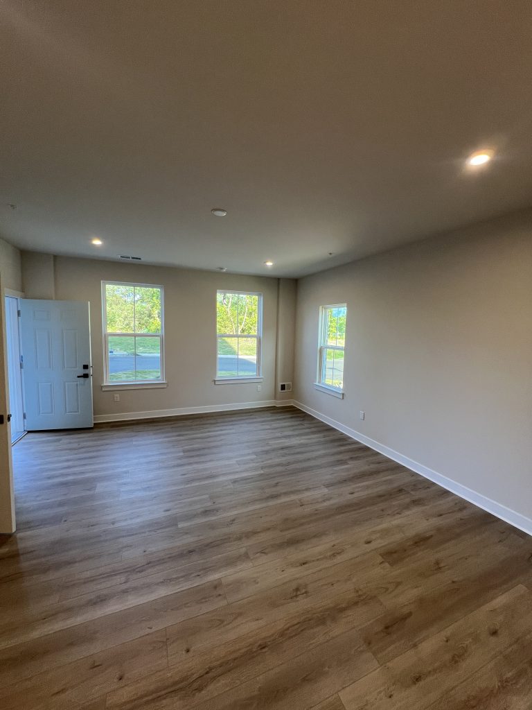 empty living room interior with off-white walls