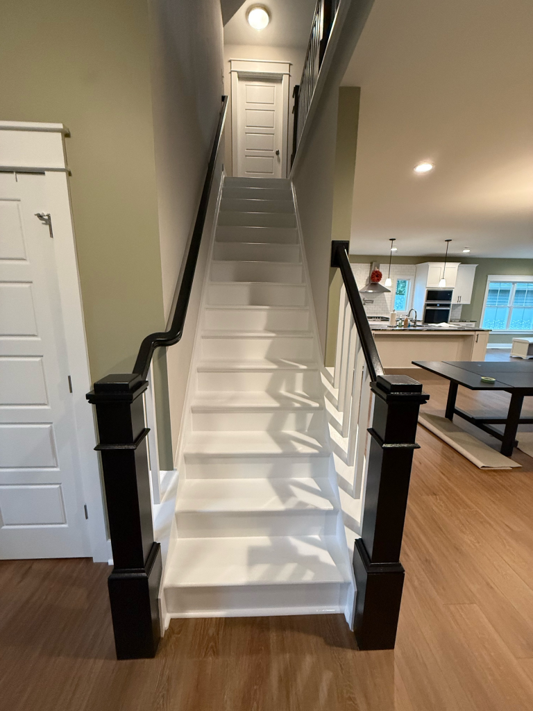 home interior staircase after black railing repaint