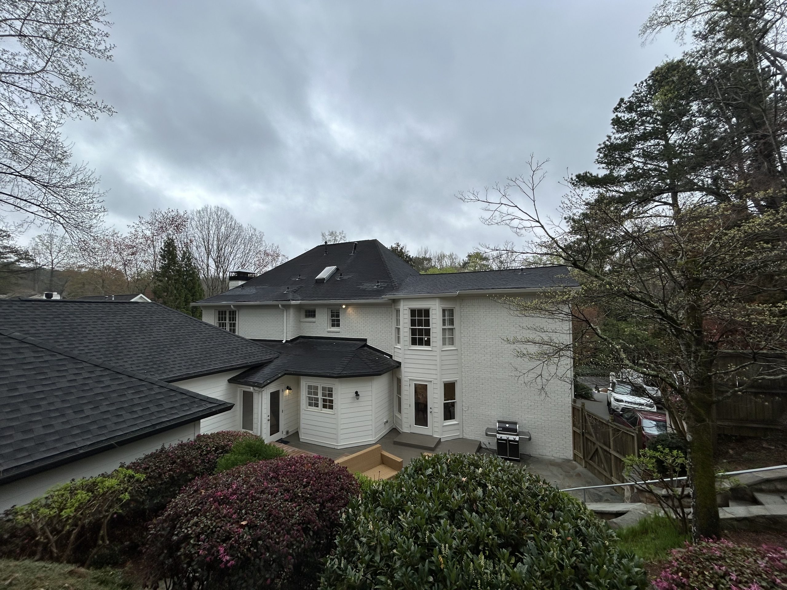 back of brick home painted white