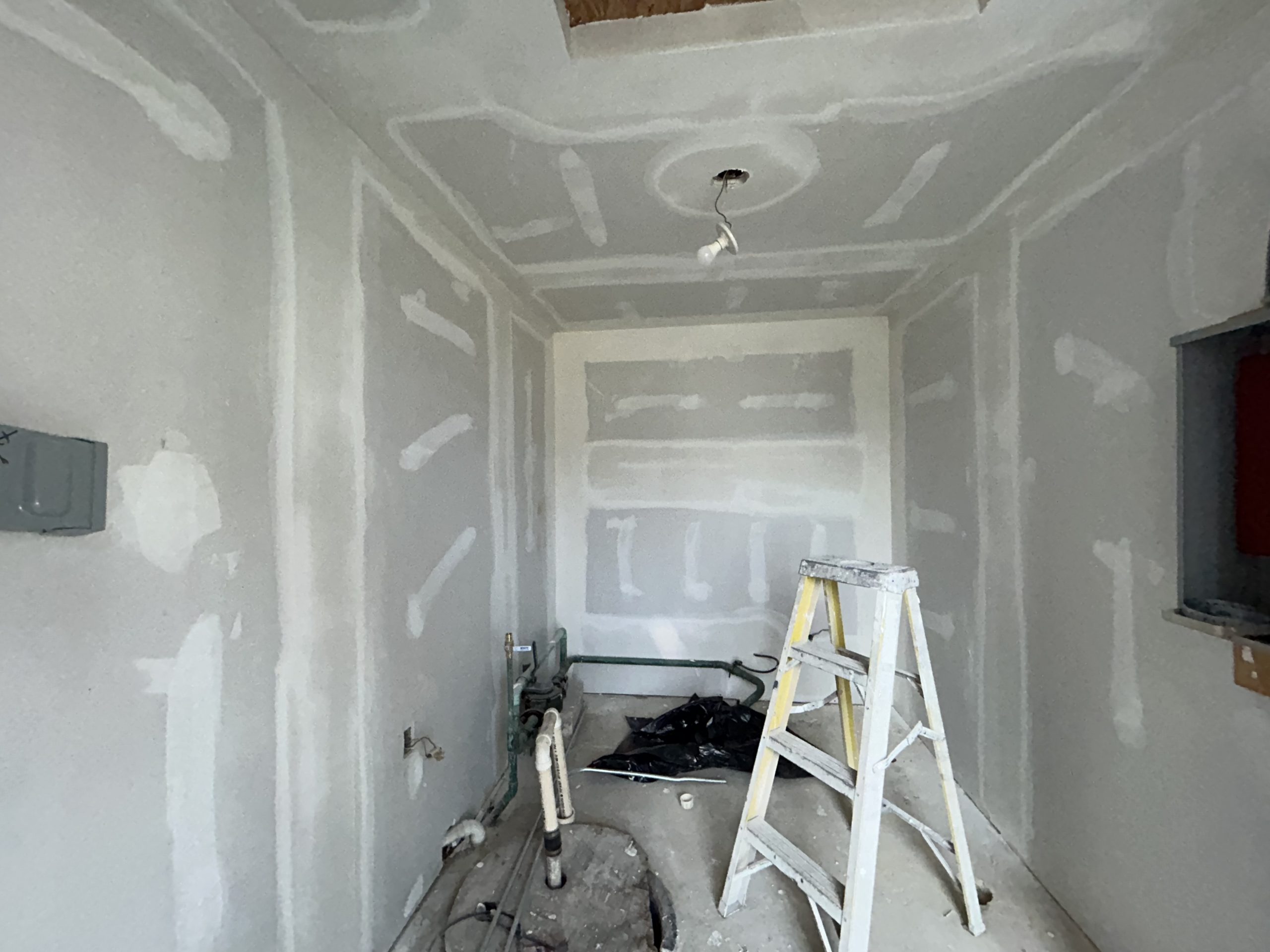 Homeowner in South Arlington DIY painting a room yellow