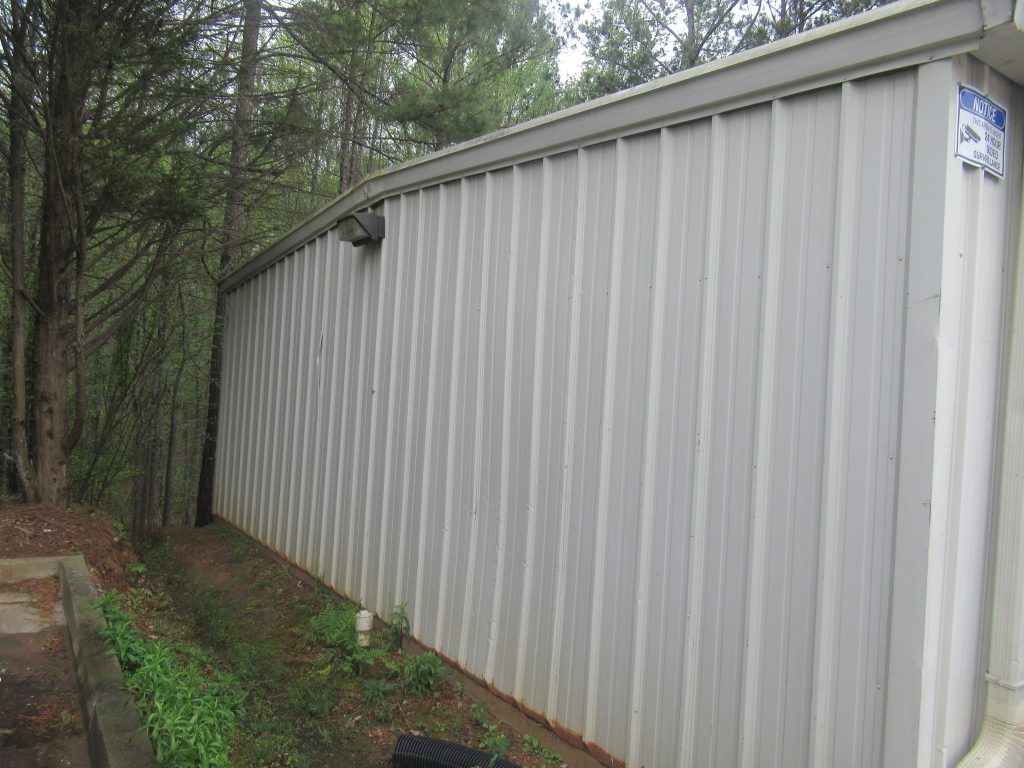 side of storage unit before repainting