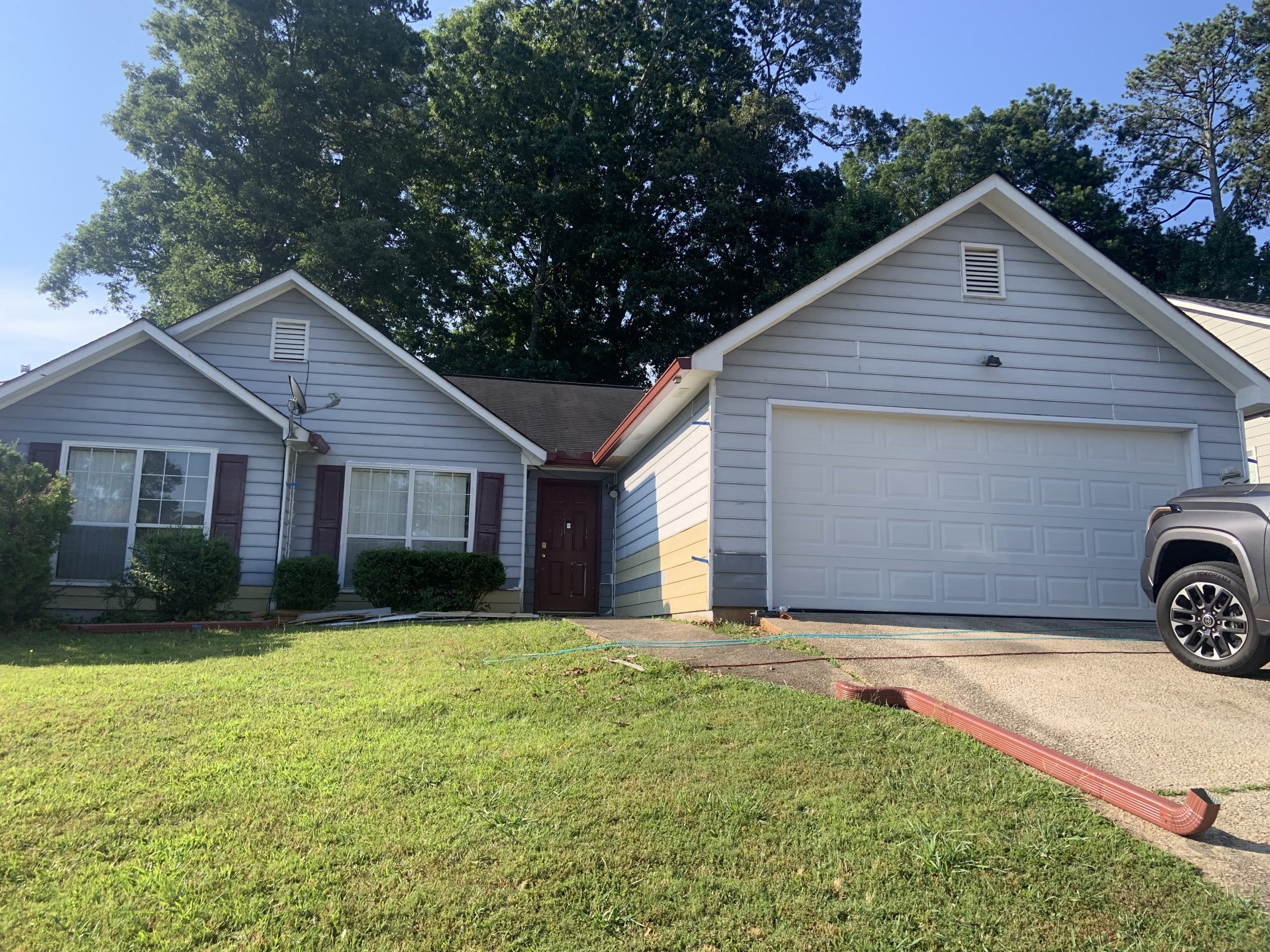 white home exterior in johns creek before being painted