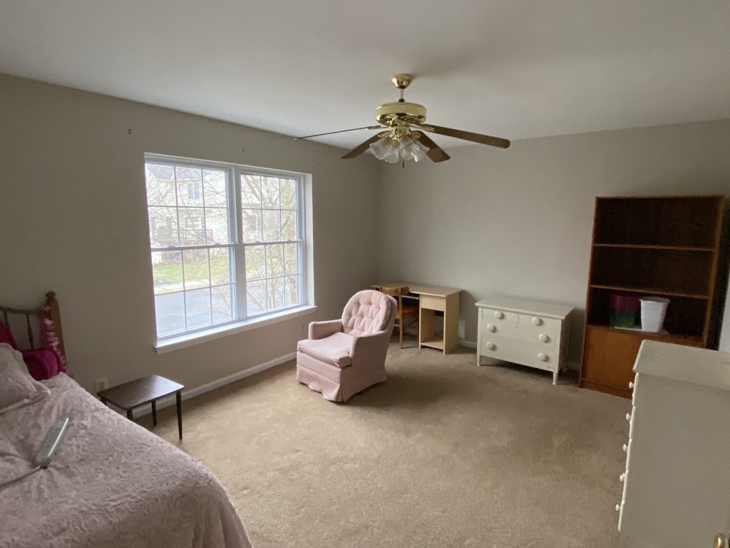 tan walls in a carpeted bedroom