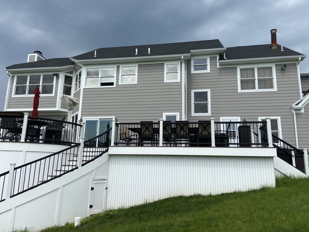 back of grey house after power washing and painting