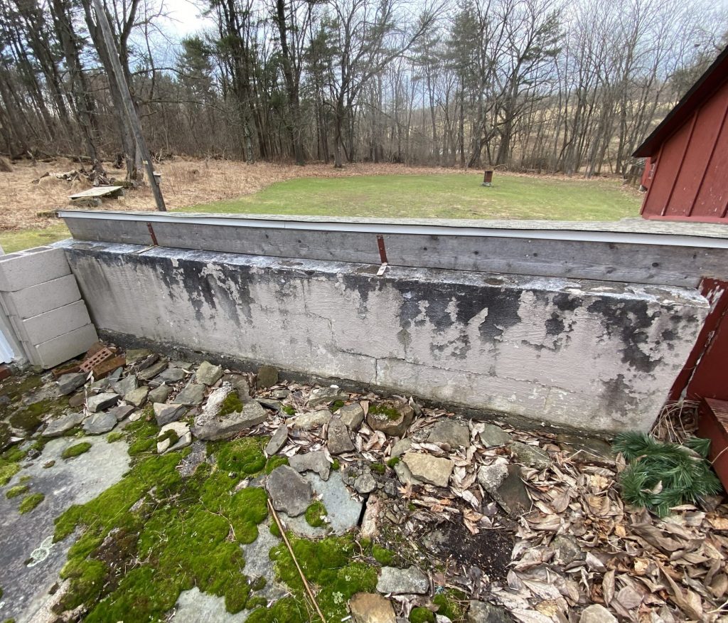 concrete wall with a lot of wear and tear