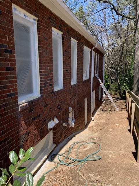 Before Exterior Side House Painting with protected windows in Winston-Salem