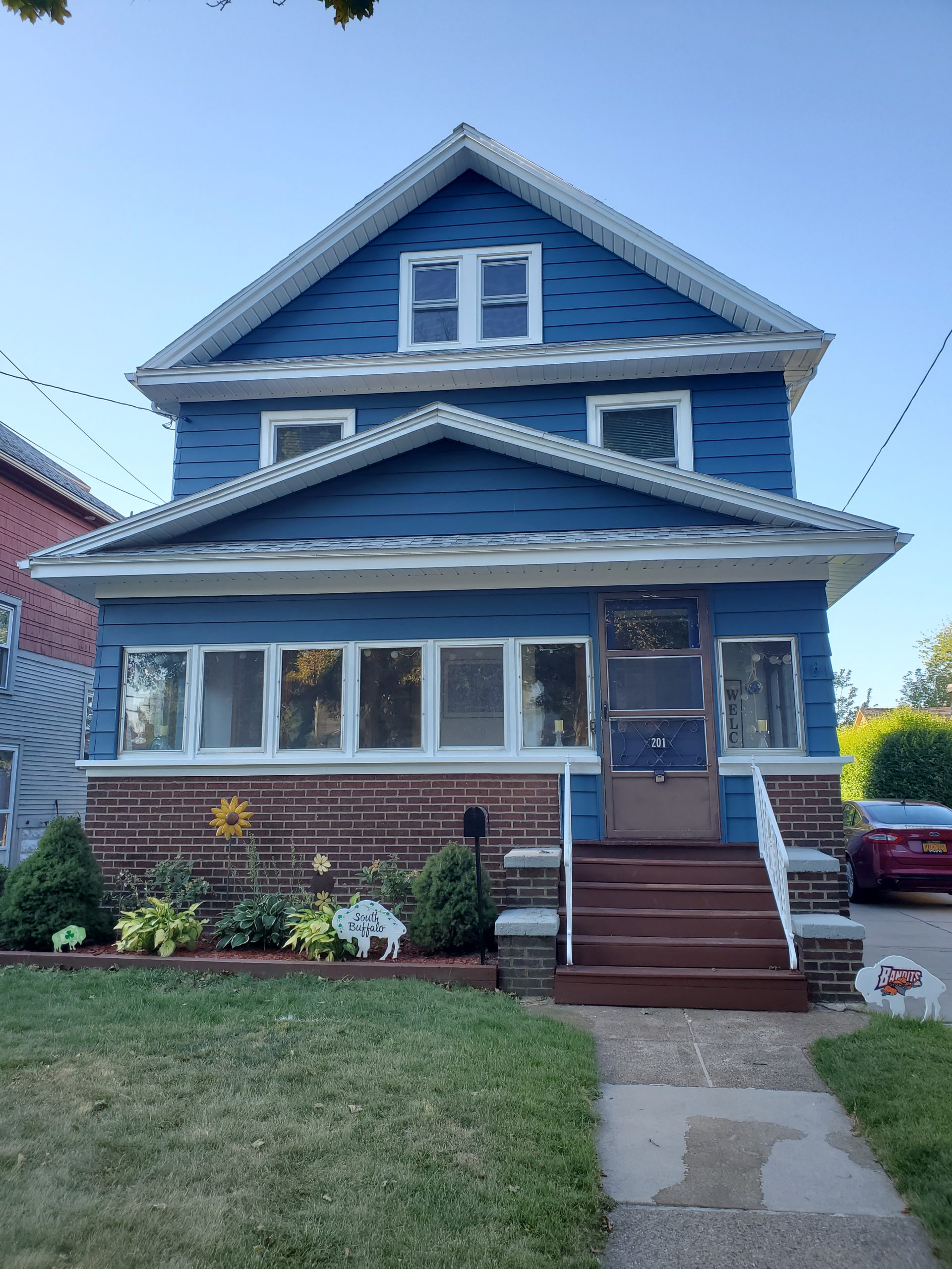 This blue and white exterior was painted by our team in Youngstown, NY