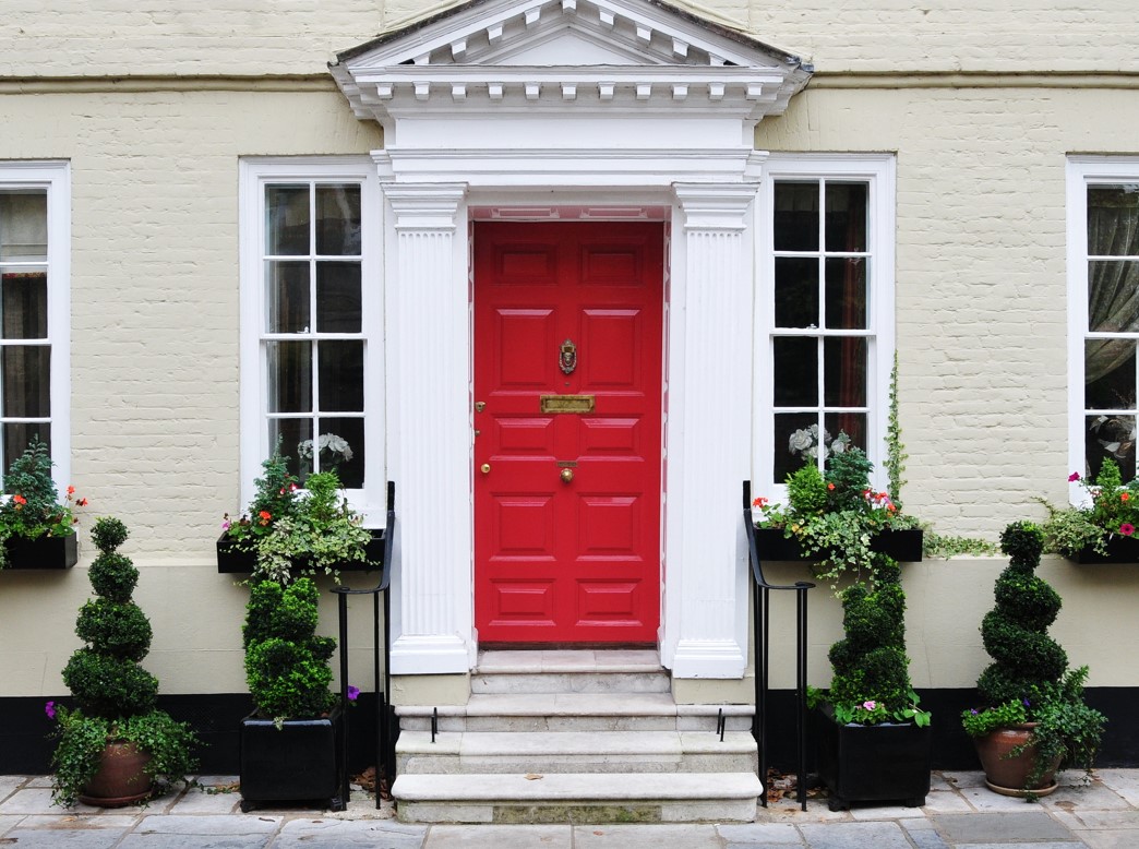 front entrance of home with painted brick