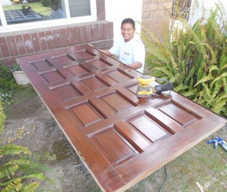 front door being sanded in prep for staining project