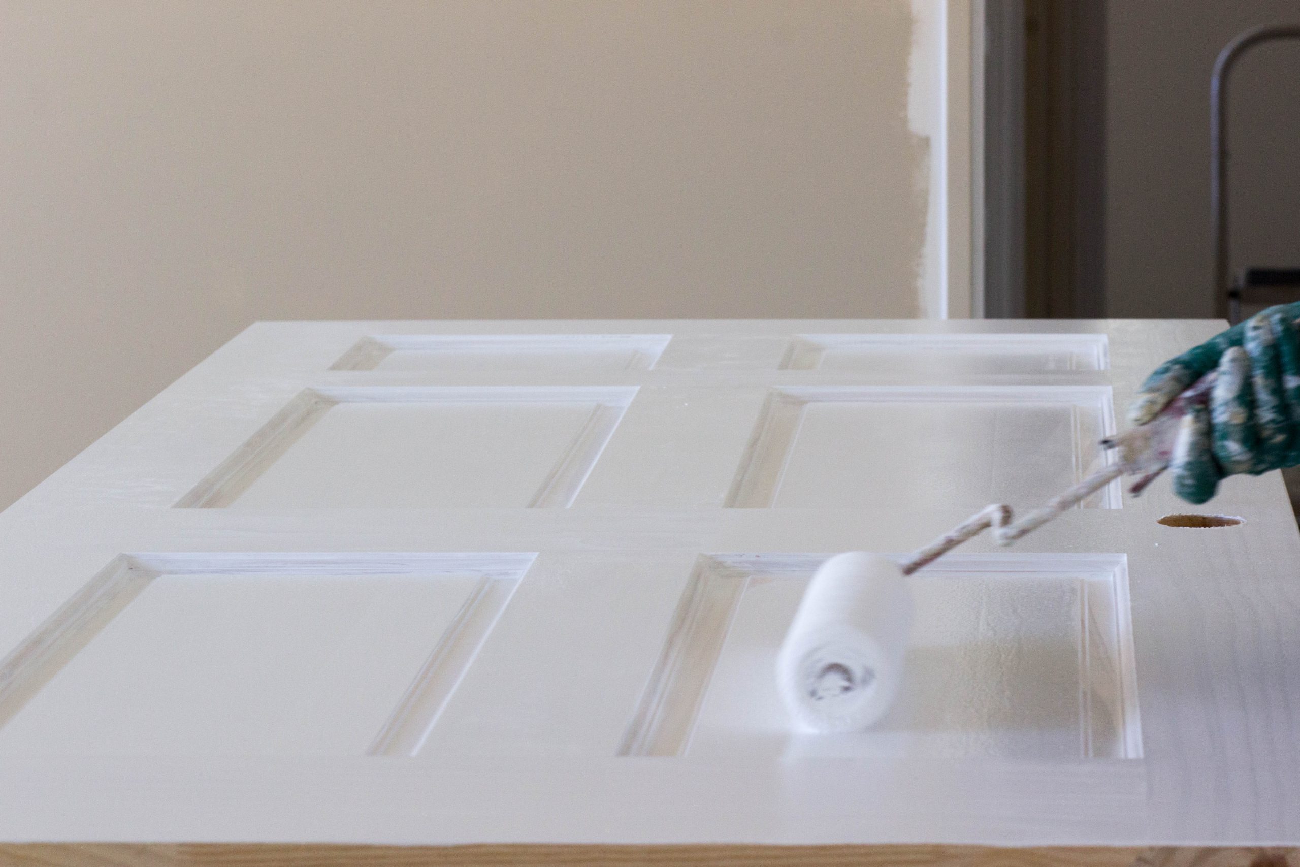 priming a wood door to paint it