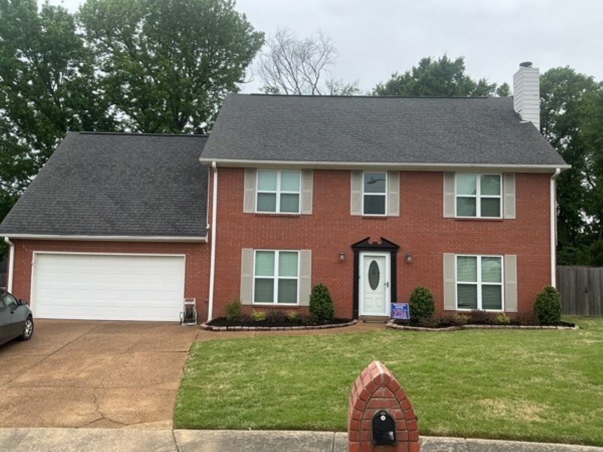 brick house exterior before shutter repaint