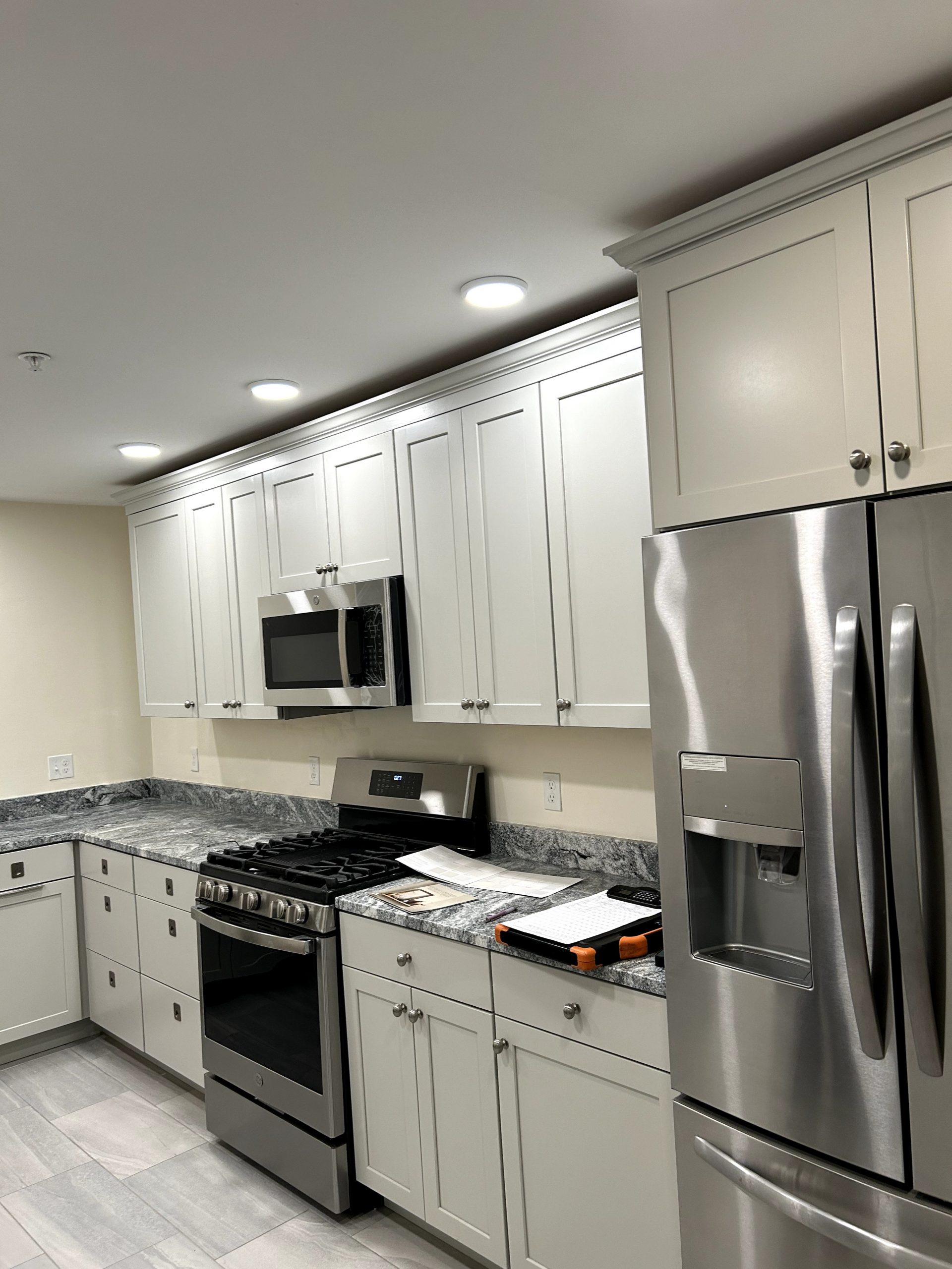 Kitchen Cabinets in Gloucester, MA, before crown molding by certapro painters of north shore and cape ann