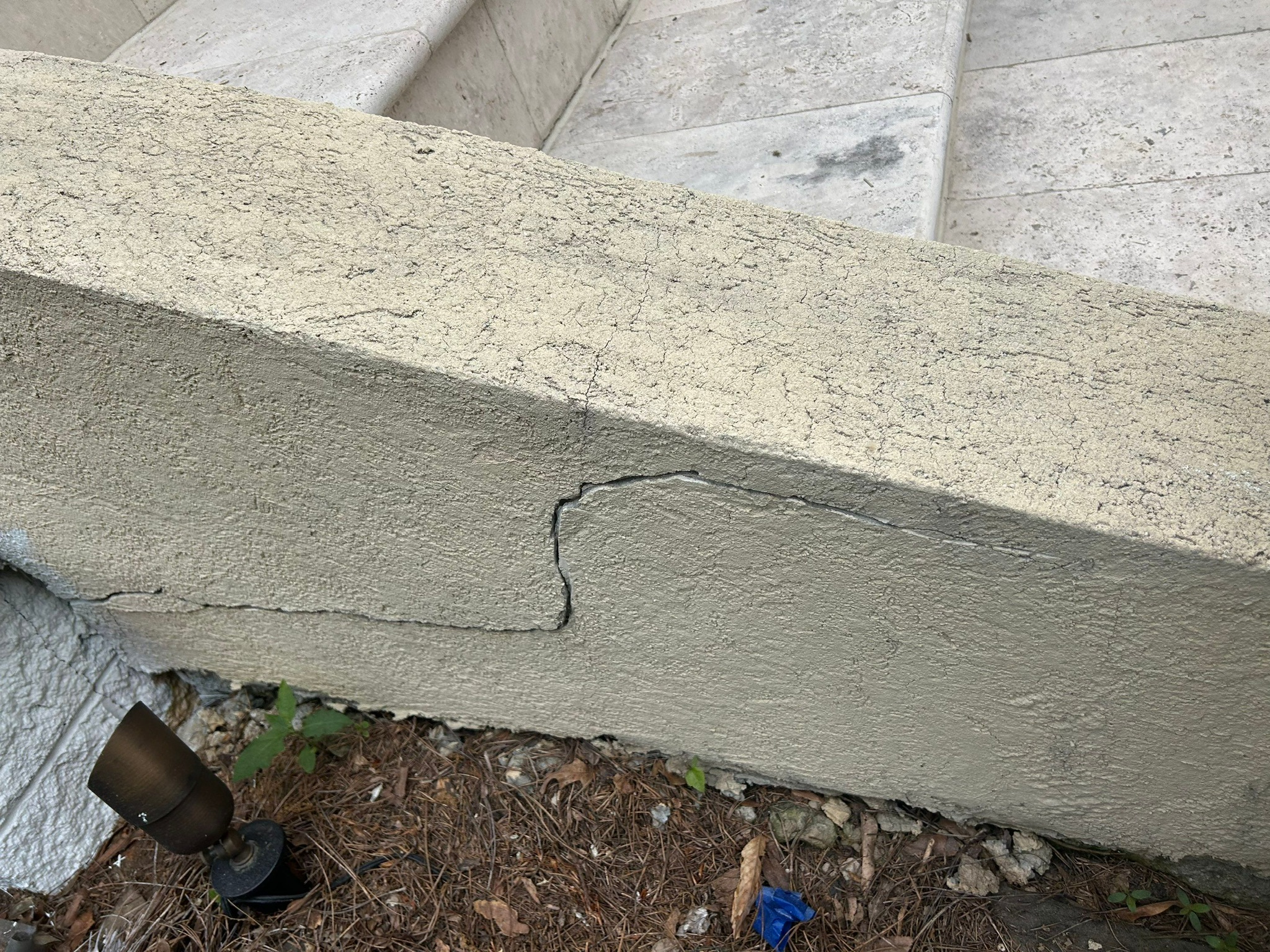 cracked masonry on outdoor steps