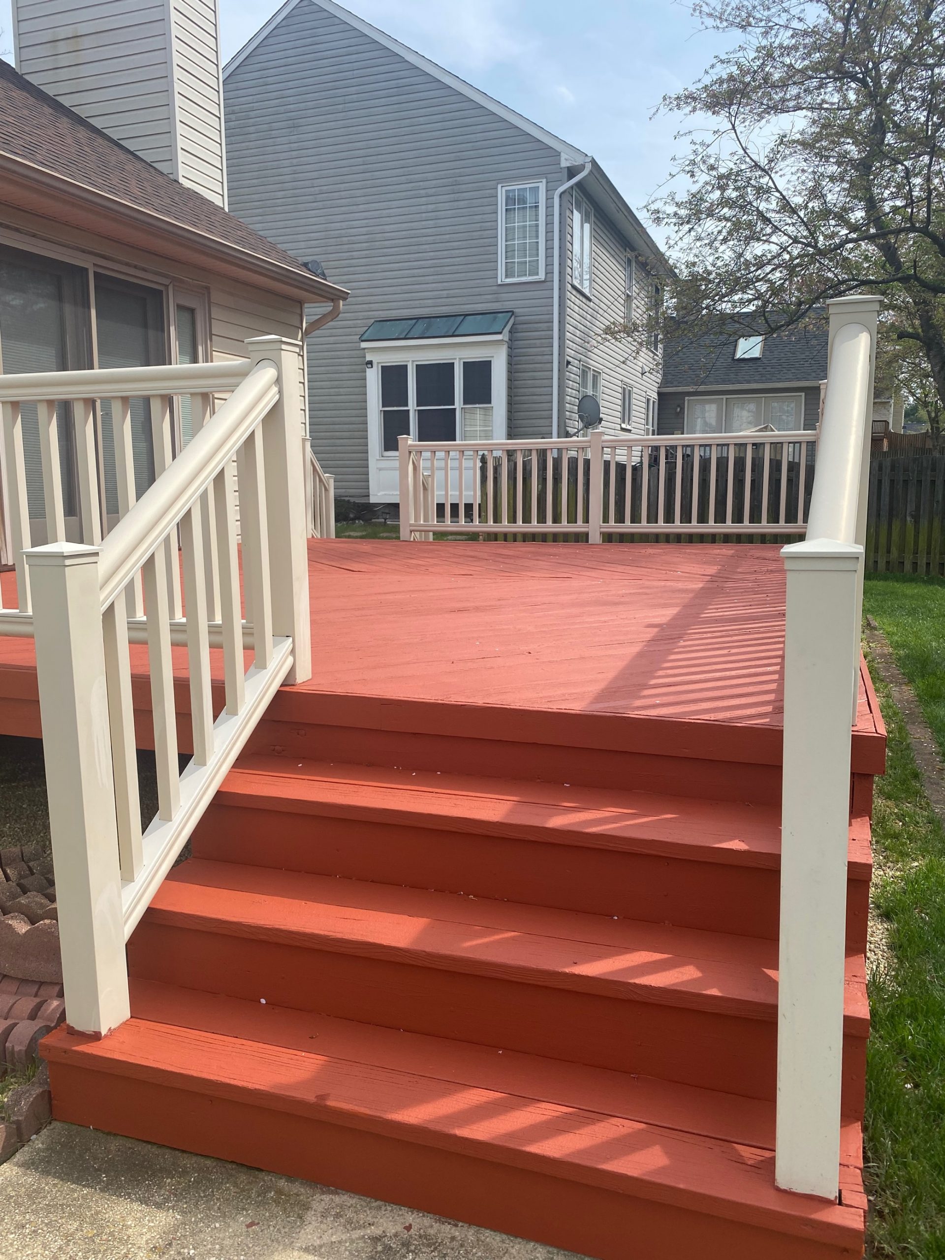 Deck Painting Refreshed with red paint