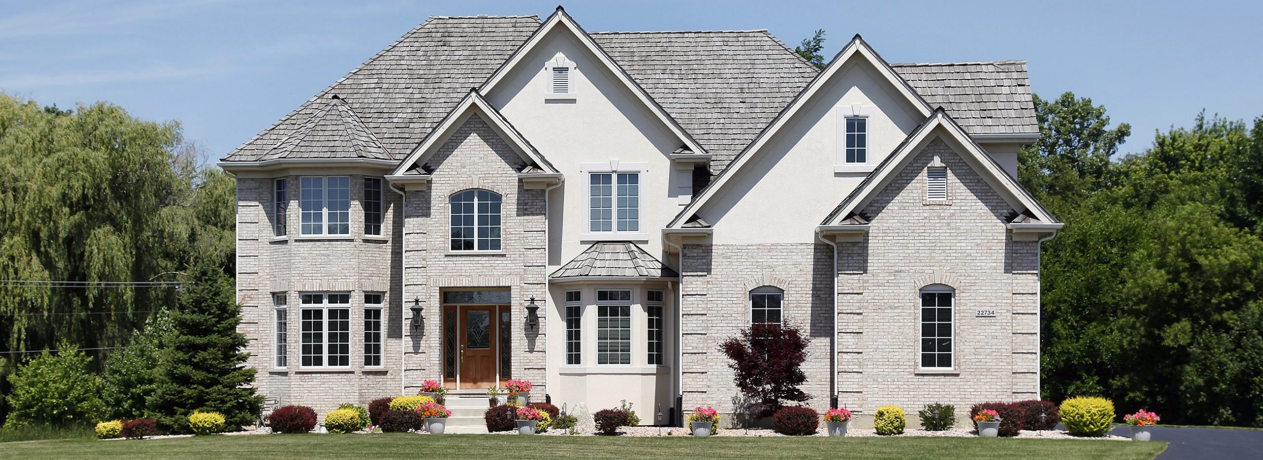 exterior of home with stucco and brick