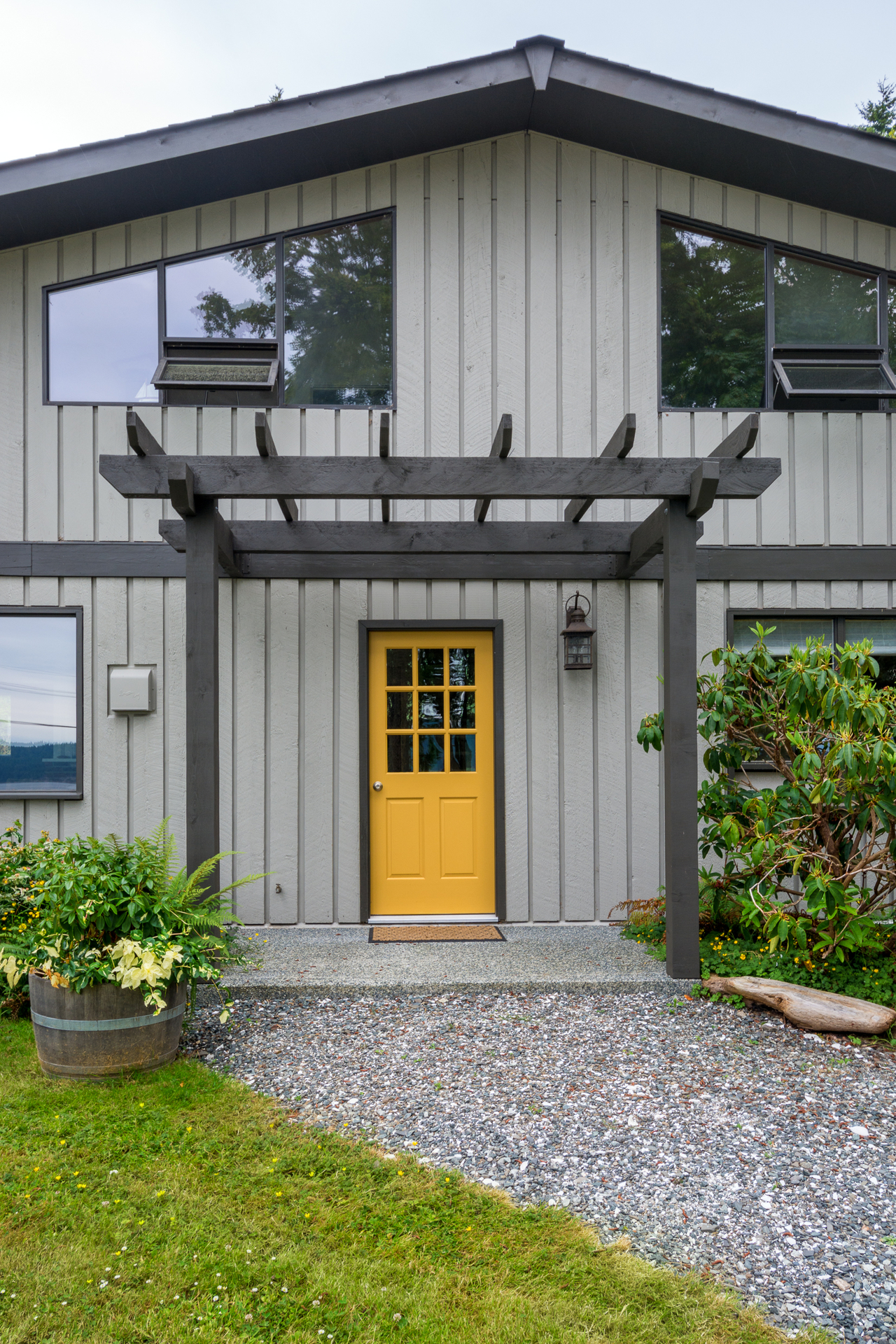 dark accents and yellow front door