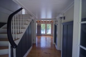 Navy blue wainscot in hallway.
