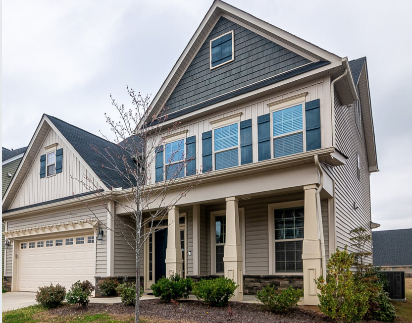 Newer home painted in interesting blue colors