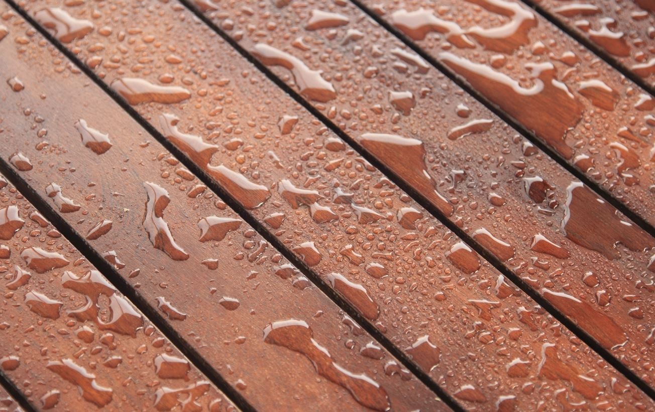 water on mahogany deck