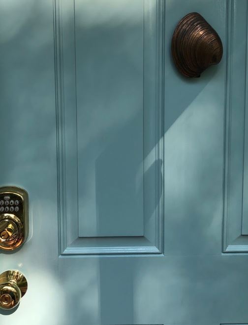 Our clam shell door knocker is re-installed. 