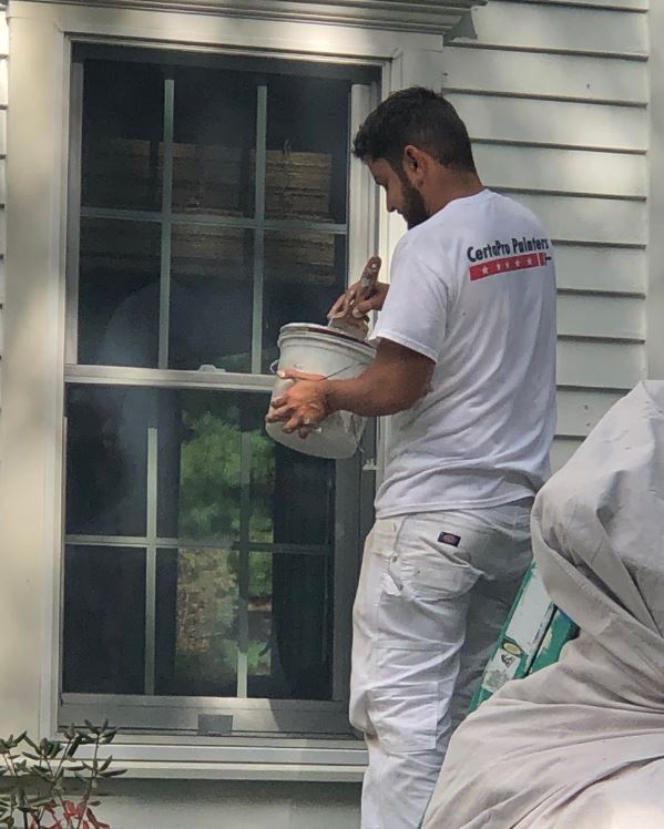 Our window trim is painted with a brush. The painters tell me that spraying only works for for large swaths of the home.