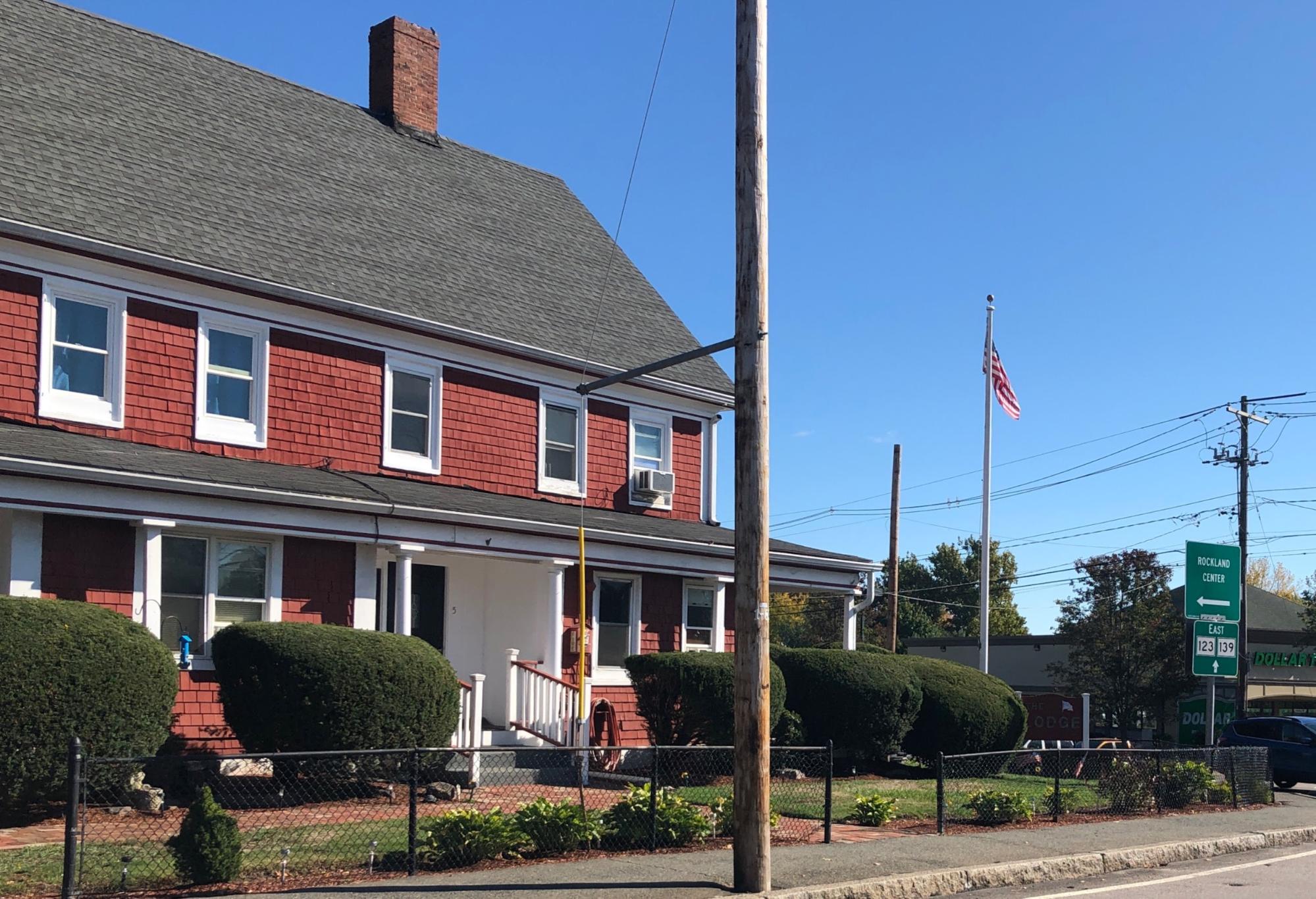 red painted shingle home in rockland ma