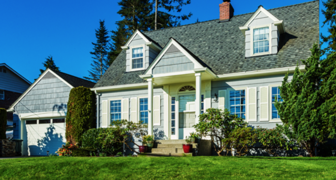 Gray Cape Cod Style home