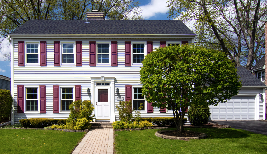 Gray house with maroon shutters