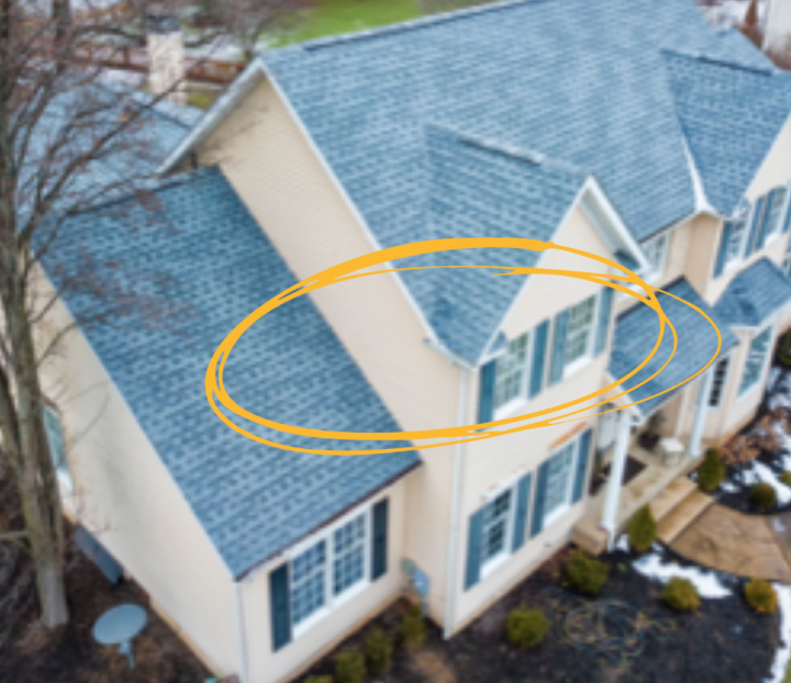 Overhead shot of large house with greenish roof